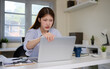 © matinee - Stressed young Asian businesswoman facing a difficult problem while working in the office.