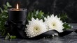 © gfxdesigner_tania - Black candle with white chrysanthemums and ribbon for funeral ceremony