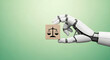 © adobe - A robotic hand delicately holds a wooden block featuring a scales of justice icon representing the ethics of artificial intelligence and law
