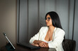 © Carlos F - Professional woman working remotely at home office