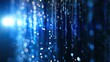 © renisa - Abstract blue background with glowing bokeh, light streaks, and falling water droplets