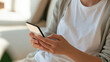 © Nova Zigres - Telehealth Concept: Hand Holding Smartphone with Blurred Medical Results
