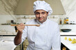 © IndiaPix - Portrait of a chef with a wooden spoon