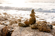 © Westend61 - A stone cairn decorates the beach at Whitesand Bay in Cornwall