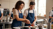 © Guilherme - Female chef teaching young man to cut vegetables