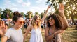 © CuteBee - Three stylish diverse young women with curly hair and sunglasses dancing and laughing at outdoor summer music festival in park during golden hour with blurred crowd in background