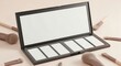 © Bima - Empty makeup palette with professional powder brushes