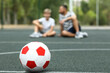 © Pixel-Shot - Father with his son and soccer ball on football field