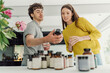 © Westend61 - Young man and woman compare health supplements at home