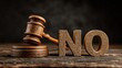 © Jannantul_ST - A wooden judge gavel stands beside a wooden word no on a dark table. Perfect concept for legal denial, objection, and judicial decisions.