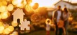 © Ekki - Family in golden sunset light with house and coins symbolizing financial security