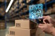 © The Little Hut - Modern warehouse logistics with digital scanning of QR code on package using tablet device