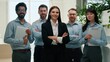 © Yuliia - Happy multiethnic business team posing with crossed arms looking at camera indoor office smiling men women female leader confident colleagues employees diverse coworkers corporate success leadership