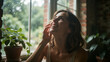 © kl yanii - Young woman enjoys peaceful morning by window