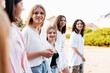 © Maria Vitkovska - Diverse teen girls walking together smiling outdoors