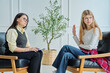 © Valerii Honcharuk - Rebellious teenage girl refusing to talk to female psychologist at therapy session