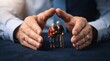 © Zunopixl  - Large human hands protecting a tiny elderly couple standing together representing insurance and care support