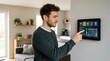 © Dara - A man is using a smart display mounted on a wall in a living room. He is adjusting the temperature and lighting controls on the screen.
