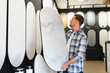 © Serhii - Man choosing decorative plaster sample for home interior design