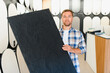 © Serhii - Man holding plaster sample choosing interior design materials