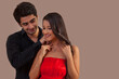 © IndiaPix - Man placing necklace on woman's neck