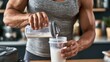 © Anna - Fit man pouring protein powder into shaker bottle for fitness supplement shake for sports design, poster, background