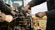 © Lucas - Two mechanics with dirty hands intensely focus on repairing a tractor engine, their skilled hands manipulating tools in a scene that embodies hard work and mechanical expertise.