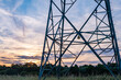 © kittyfly - High voltage metal transmission tower, power lines and electricity pylons against sky electrical network, Sustainable energy infrastructure and power supply concept, industrial scenery, power station