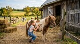 Little Girl Brushing Adorable Pony on a Sunny Farm Day.
