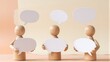 © joeycheung - Three wooden figures hold speech bubbles, symbolizing communication or dialogue.