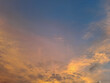 © ADP - A breathtaking view of a dramatic sunset or sunrise sky featuring colorful glowing clouds, blue and orange color gradients, and soft textures. Ideal for nature backgrounds, weather concepts, and inspi