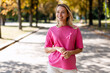 © Maria Vitkovska - Woman wearing pink ribbon supporting breast cancer awareness