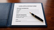 © MdZamal - Filling out financial loan application form with pen, application