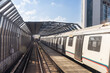 © ThamKC - Mass rail transit train passing through tracks with sound barrier in the city of Kuala Lumpur. Sound barrier tunnels are designed to minimize noise pollution to surrounding area.
