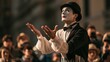 © Natalia - Professional mime artist in classic black and white costume performs an invisible painting act in a European city square, using expressive gestures as fascinated people watch the artistic street perfo