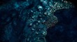 © SleepWorker - Cinematic close-up of deep midnight blue indigo dye vat surface with bubbles and organic textures