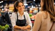 © Galina Petrova - Friendly retail worker assisting customer at store counter, representing customer service, shopping experience, business communication and professional hospitality.