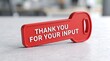 © Md - Red plastic key with Thank You For Your Input text, feedback and survey concept, customer appreciation message on desk