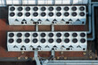 © AmazingAerialAgency - Aerial view of industrial cooling units on a rooftop, essential for maintaining AI data center efficiency, featuring rows of large fans and ventilation pipes in Poland.