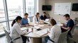 © Kai - Diverse medical team meeting in conference room discussing patient cases, doctors and nurses reviewing documents, healthcare professionals collaboration, hospital administration