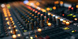 © Jan - Close-up of a professional sound mixer console with numerous knobs, faders, and glowing indicator lights in a recording studio or live event setting, creating a dynamic and technological