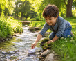 © Ярослав Нечеса - A sweet child kneeling by a small natural stream in a green park, gently launching a white paper boat into flowing water, peaceful eco-friendly childhood activity