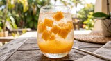Refreshing mango sparkling drink with ice cubes
