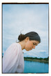 © Yana Bulgakova/Stocksy - Thoughtful woman by the peaceful river