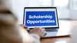 © A2Z AI  - Person use laptop computer to search for scholarship opportunities online, hands on keyboard, blue screen, education