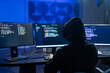 © Art_Photo - Hacker male wearing hoodie typing on computer keyboard in dark room, Concept of cybersecurity, cybercrime, software engineering, dark web, data breaches and modern digital network protection