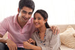 © IndiaPix - Portrait of relaxed young couple smiling at home