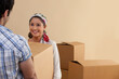 © IndiaPix - Beautiful young woman holding cardboard box with man