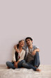 © IndiaPix - Full length of young couple looking up at copy space
