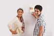 © IndiaPix - Portrait of young couple selecting color for their wall